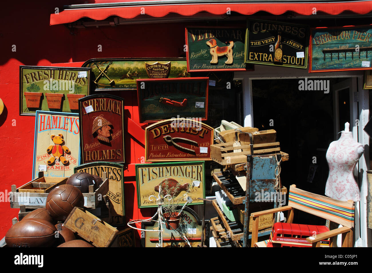 Antique signs for sale at a shop in Portobello Road Stock Photo Alamy