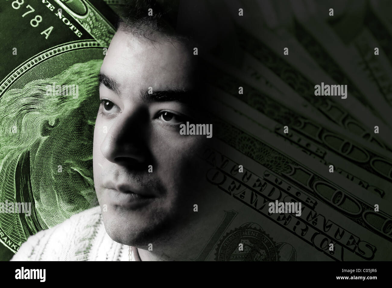 A young man with money on his mind. A great image to illustrate
