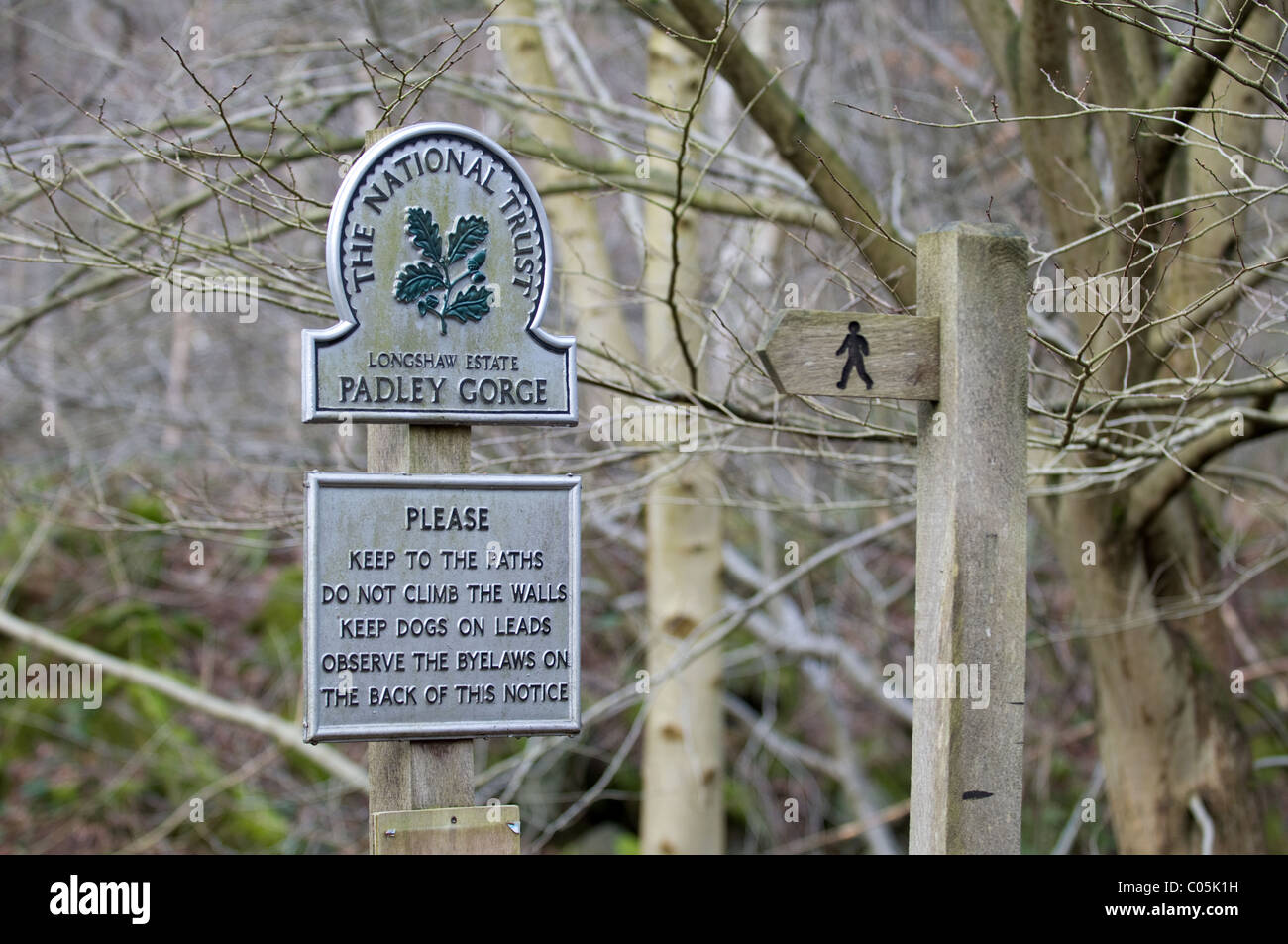 National Trust sign in Padley Gorge showing footpath direction in the Peak District Nation Park Derbyshire East Midlands Uk Stock Photo
