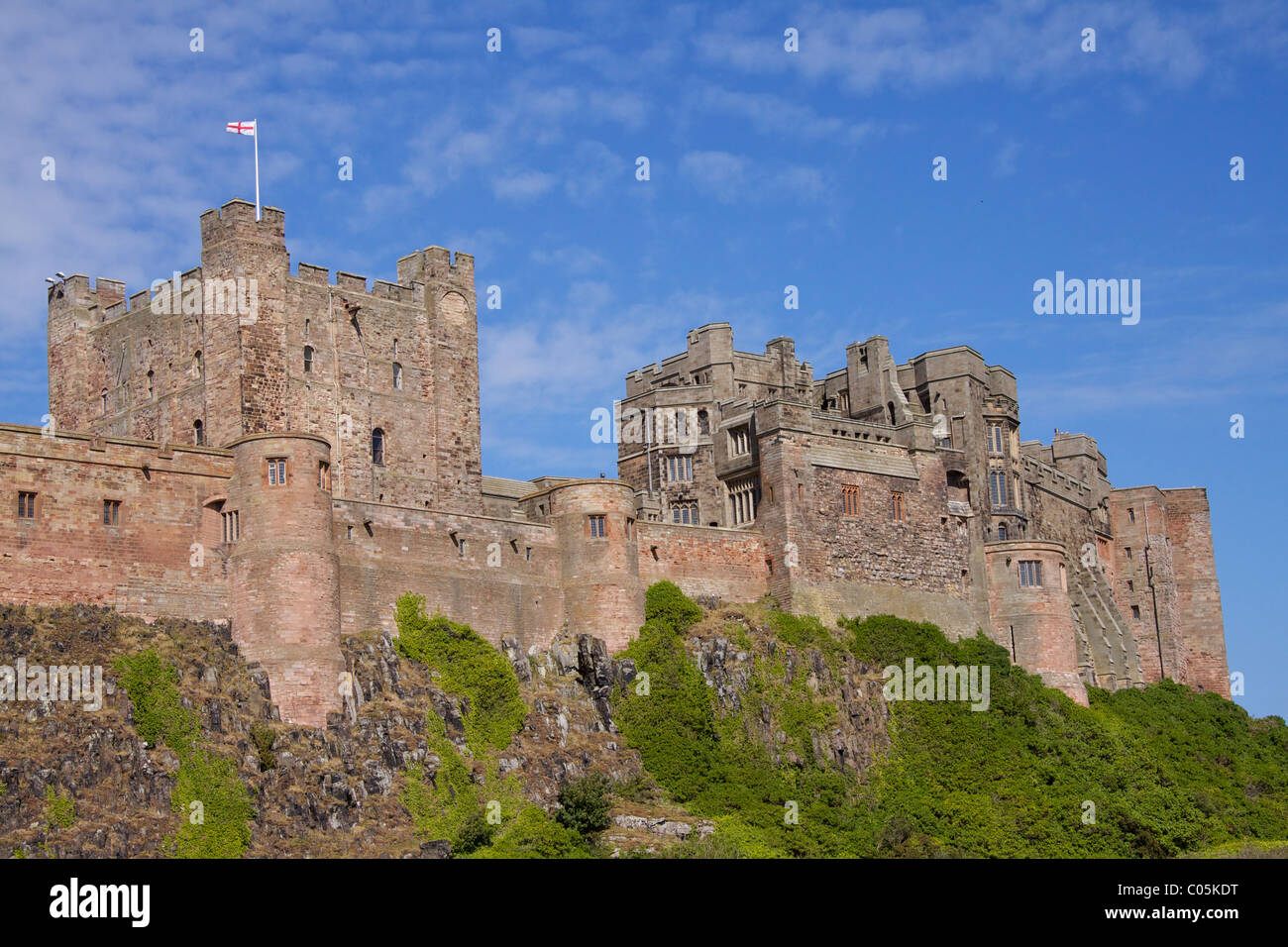 Bamburgh Castle, built on a basalt outcrop rebuilt by the Normans in the 9th century in Bamburgh in Northumbria Stock Photo