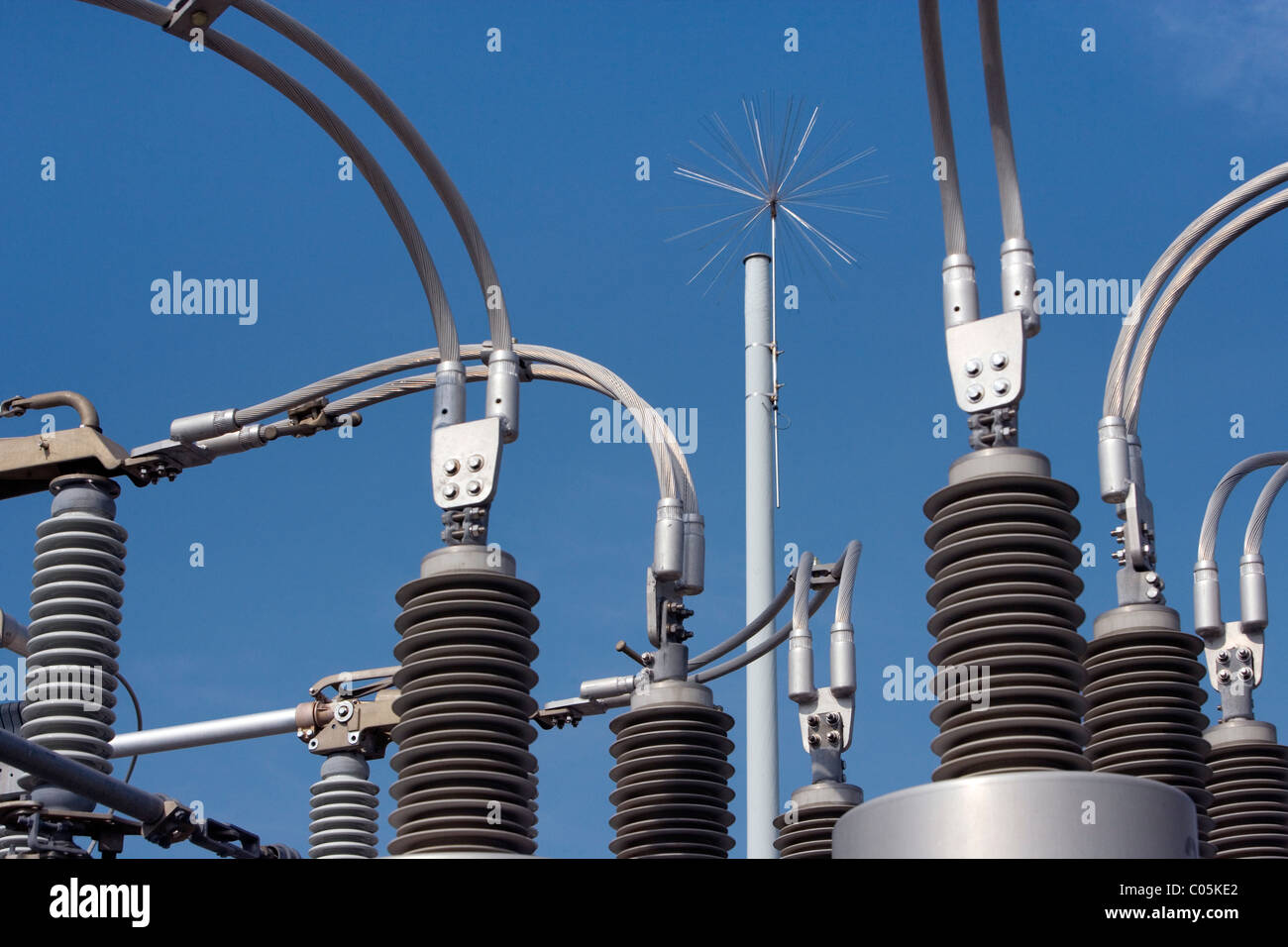 A lightning arrestor or dissipator atop an electrical power transfer station. Stock Photo