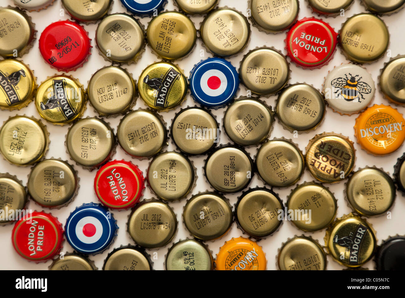 Crown beer bottle caps, some printed with brand names others with "best