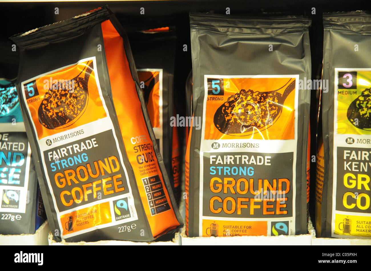 Packets of fairtrade coffee on a shelf in a supermarket in England Stock Photo