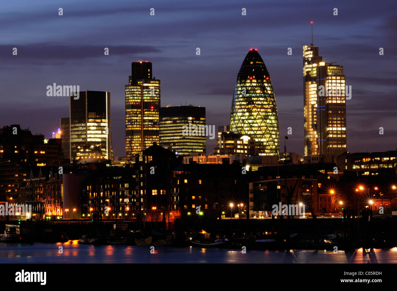 City of London Skyline at Night including Tower 42, 30 St Mary Axe and Heron Tower seen from Bermondsey, London, England, UK Stock Photo