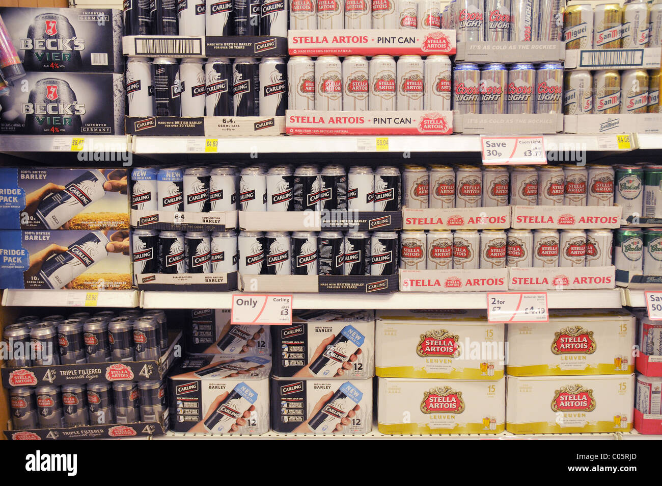 Tins of beer on a shelf in a supermarket in England Stock Photo