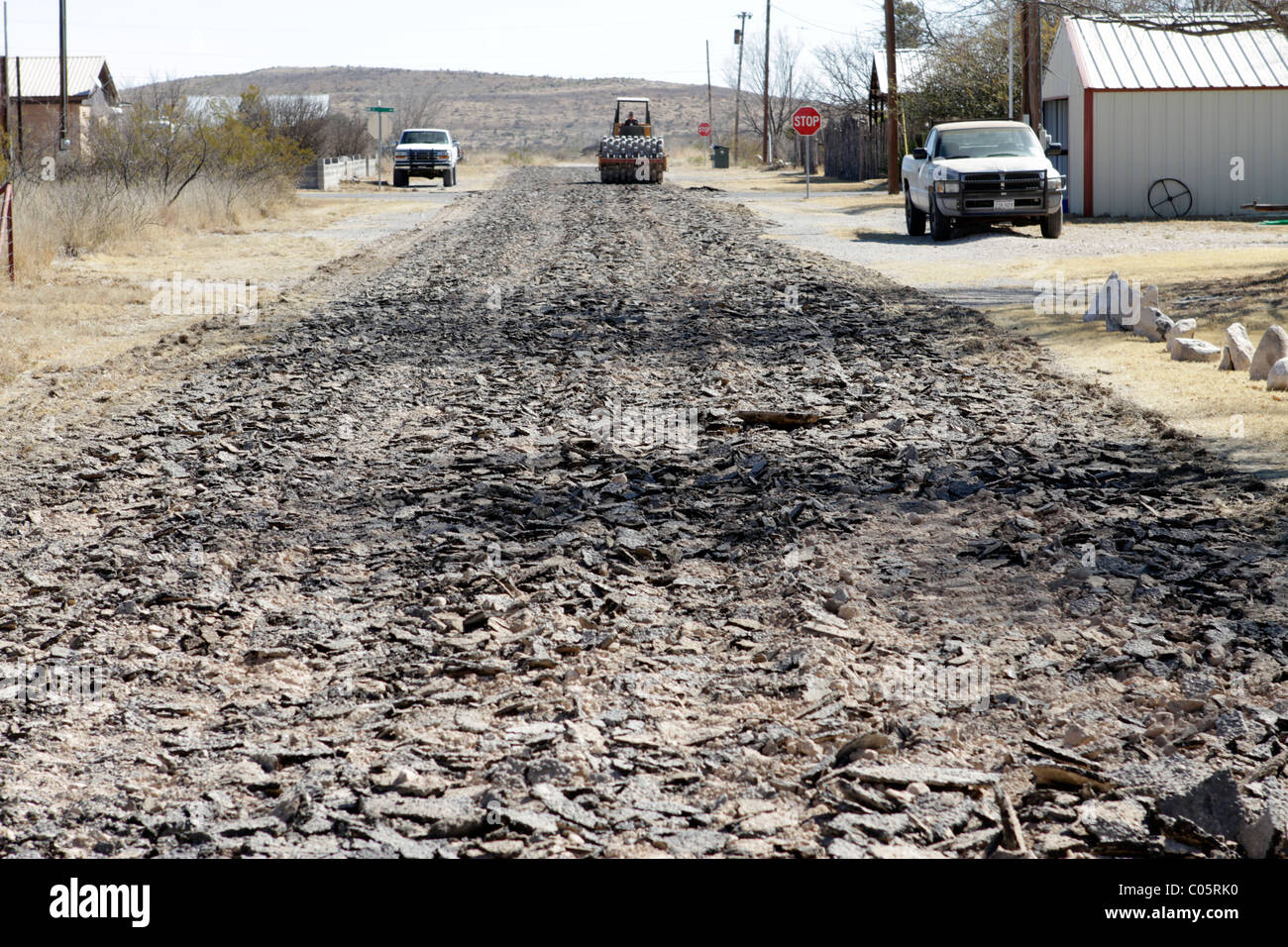 Impact roller breaking a street surfacing before re-pavement in a small West Texas town. Stock Photo