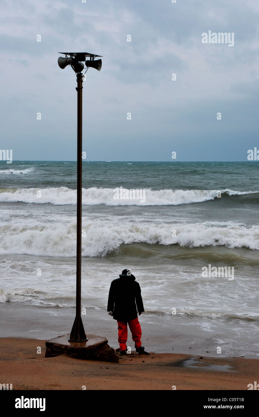 Man looking out to sea Stock Photo - Alamy