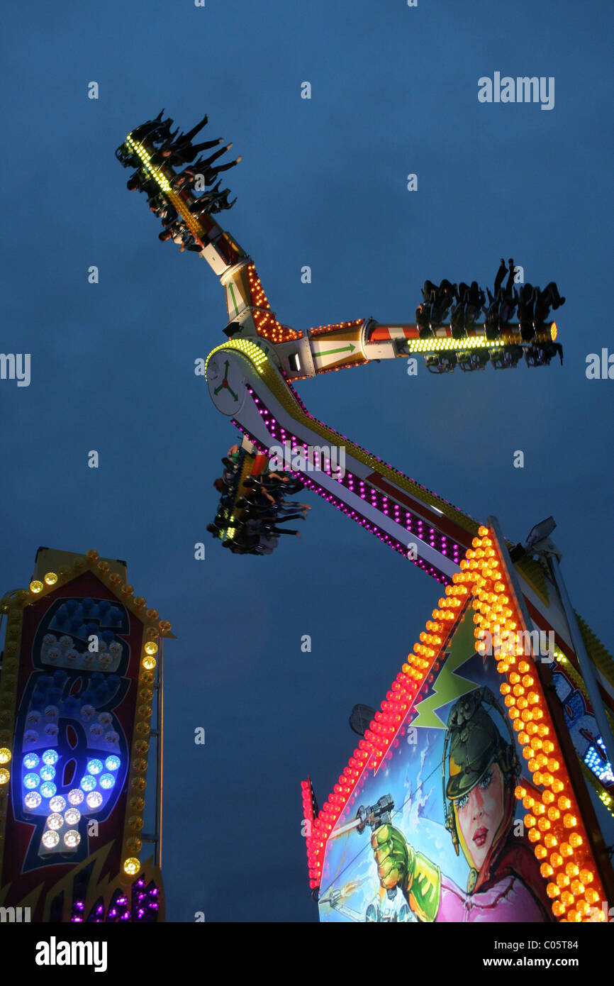 Thrill seekers on a ride at the Sydney Royal Easter Show, Sydney, New South Wales, Australia. Stock Photo