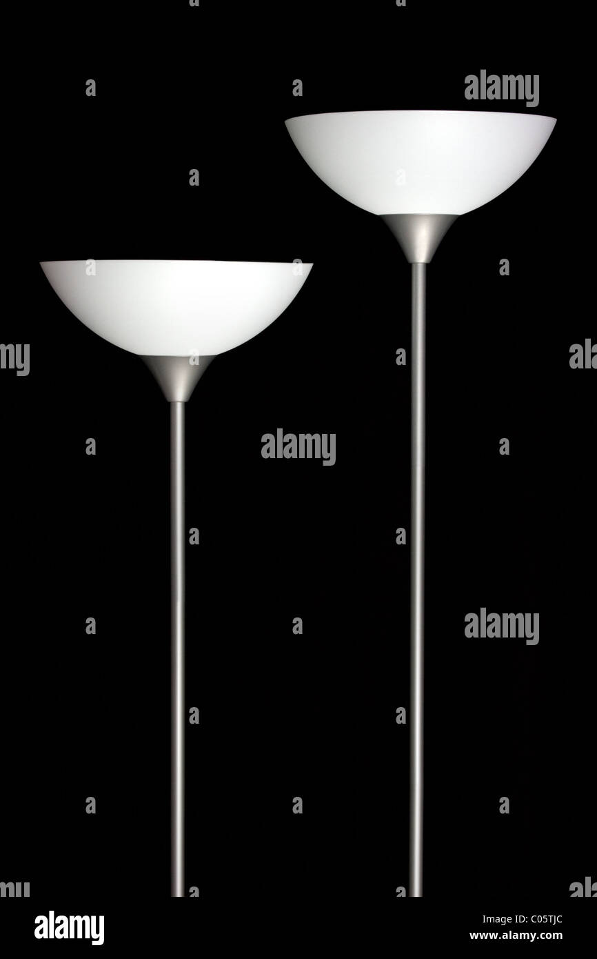 Two Upright Lamp Stands isolated on black background Stock Photo Alamy