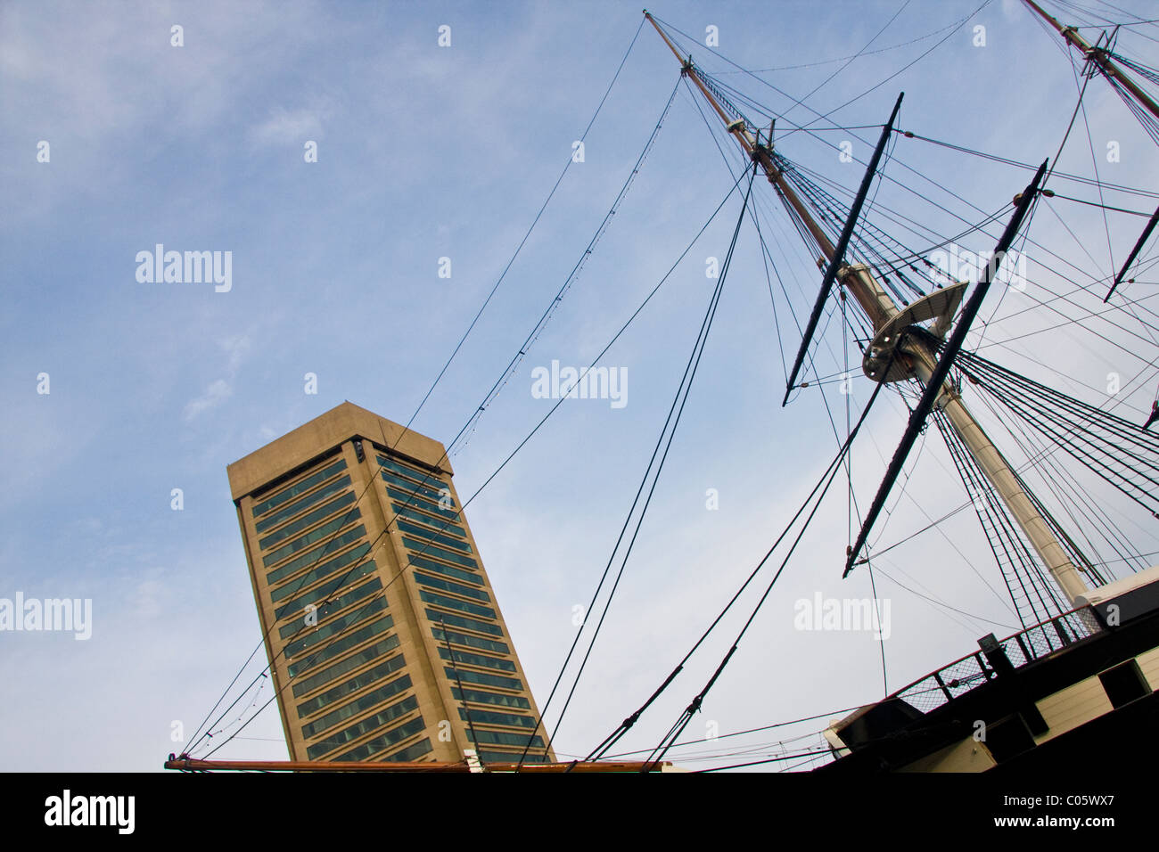 The 1854 sloop-of-war USS Constellation and The World Trade Center at the Inner Harbor Baltimore Maryland Stock Photo