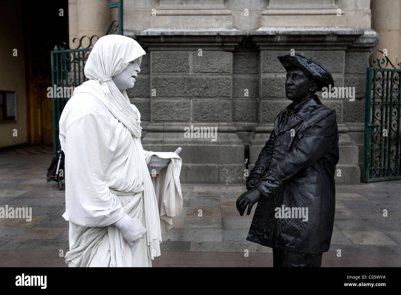Two basking man meeting and chatting, placa de armas Santiago de Chile Stock Photo