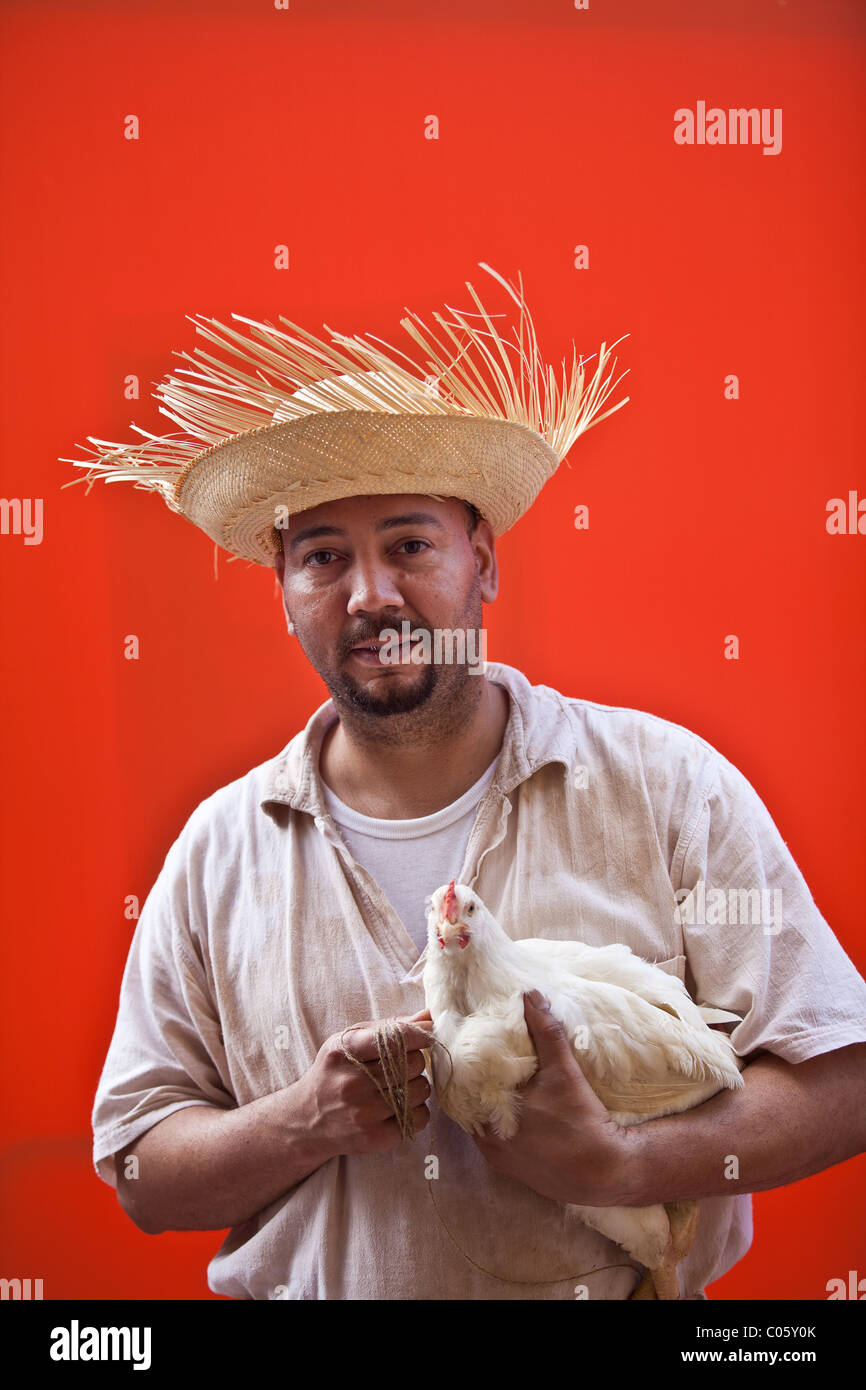 A man dressed in traditional Puerto Rican costume with chicken San  Sebastian Festival in San Juan, Puerto Rico Stock Photo - Alamy