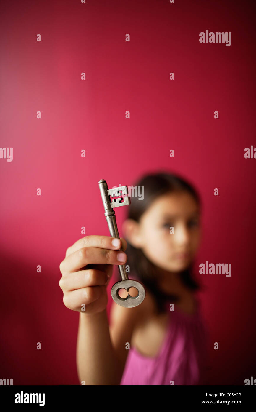 Girl holds key Stock Photo