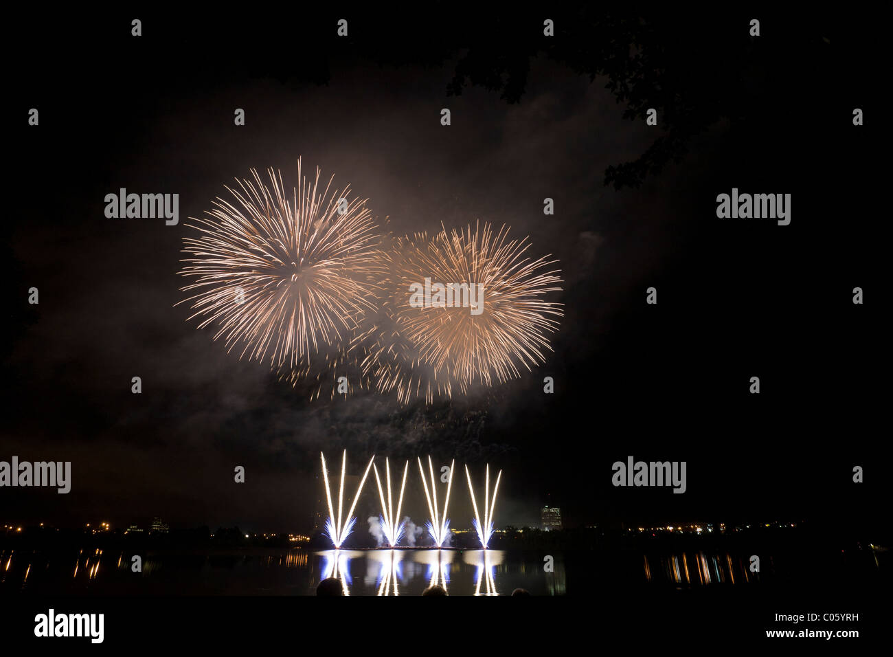 Fireworks burst over Lac Leamy from a barge. Les grands feux du Casino du Lac-Leamy an annual competition Stock Photo