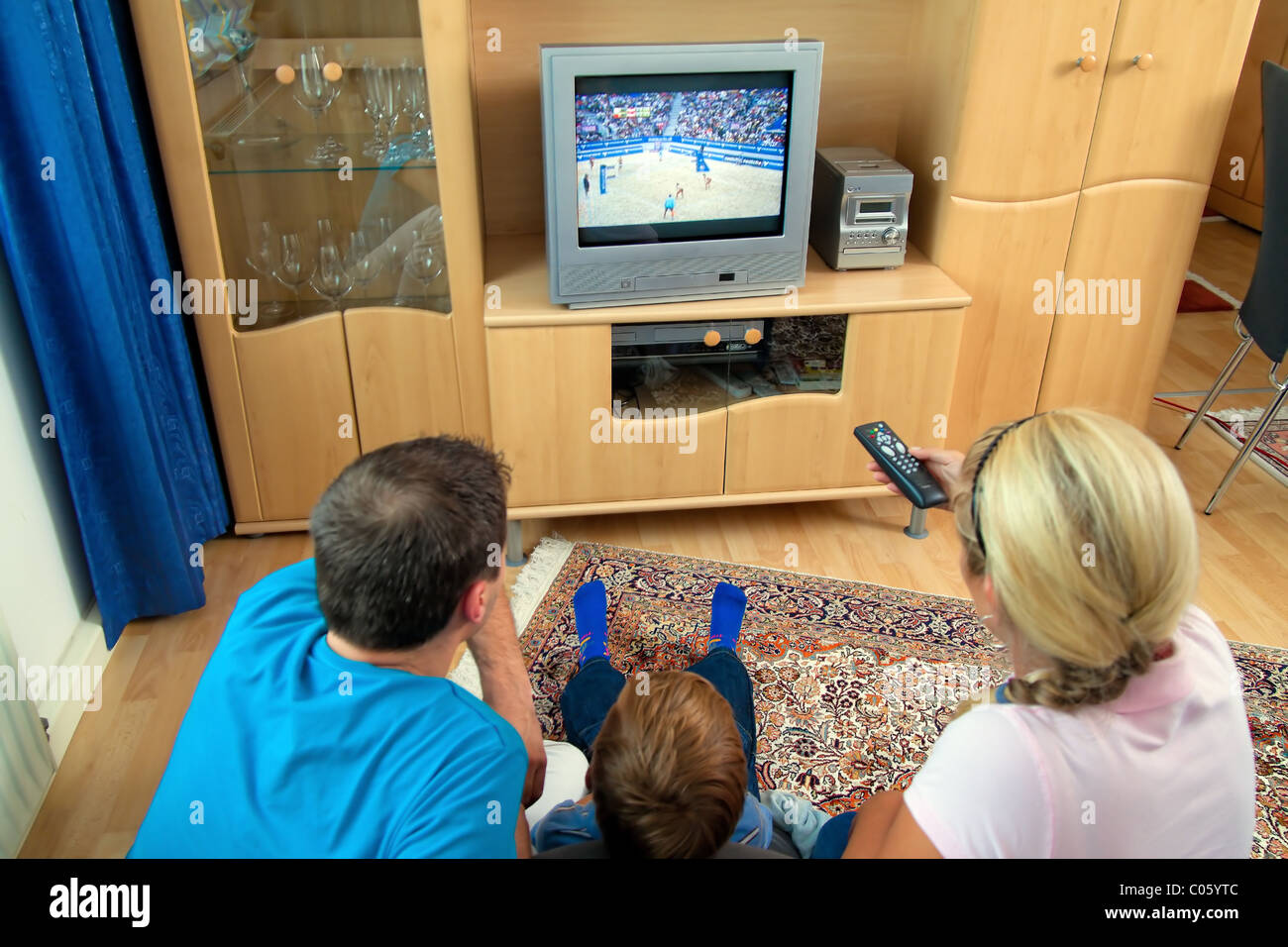 Family watching TV with TV Stock Photo