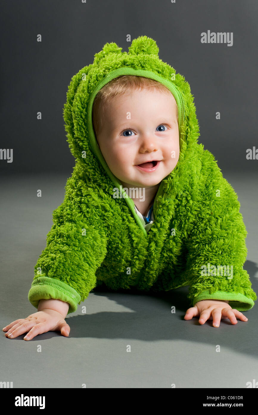 Baby wearing a frog costume Stock Photo Alamy