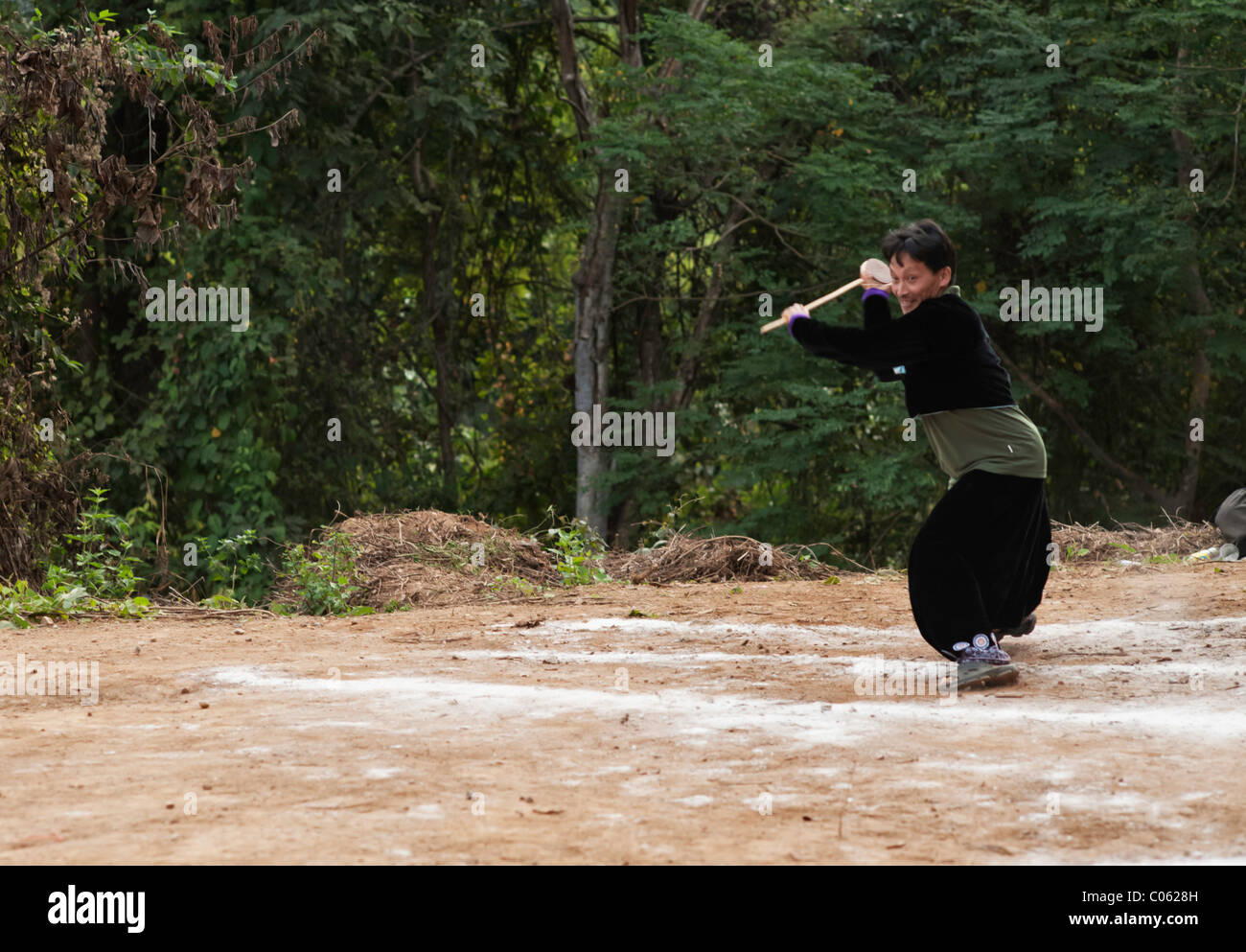 Traditional spinning top (Tujlub) competition action at a Hmong new