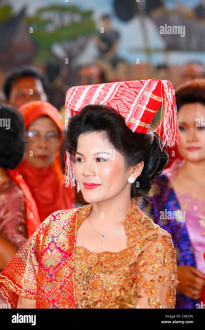 Woman wearing a headdress, guests at a wedding ceremony, Siantar, Batak region, Sumatra, Indonesia, Asia Stock Photo