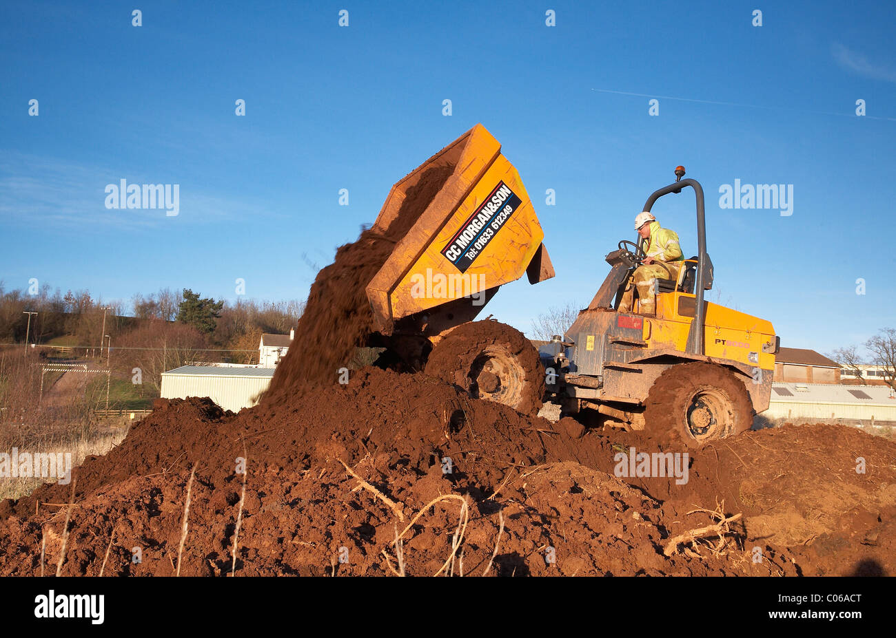Dump truck emptying its bucket full of earth Stock Photo Alamy