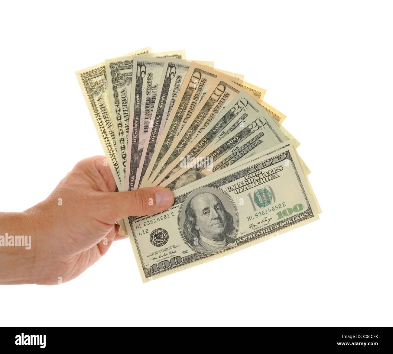 Hand holding a fan of several U.S. dollar banknotes, 100, 20, 10, 5, 1 Stock Photo