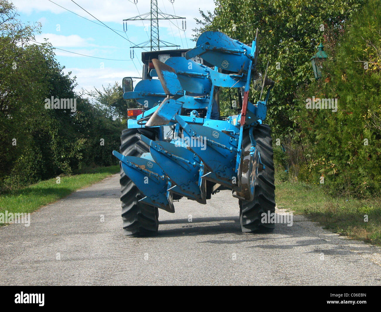 Tractor with plow Stock Photo - Alamy