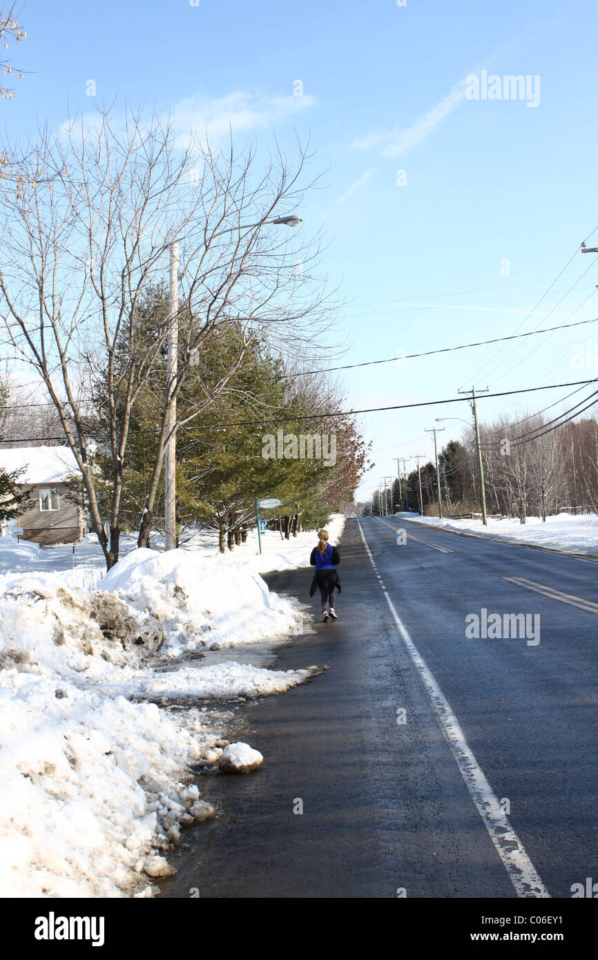 Woman walking snow facing hi-res stock photography and images - Alamy