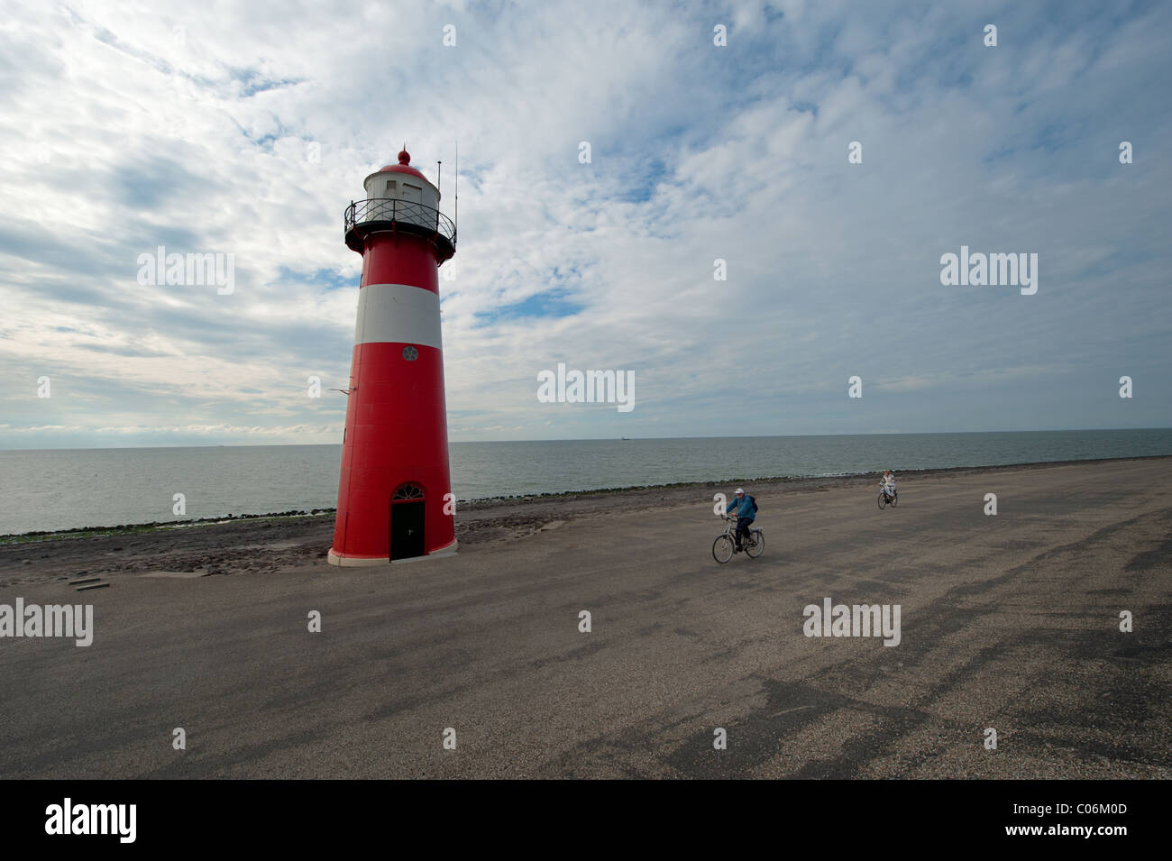 Red and white lighthouse in Zeeland the Netherlands Stock Photo