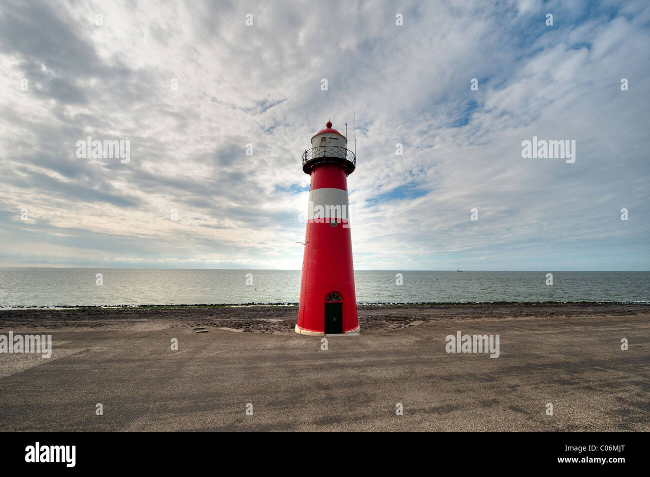 Red and white lighthouse in Zeeland the Netherlands Stock Photo
