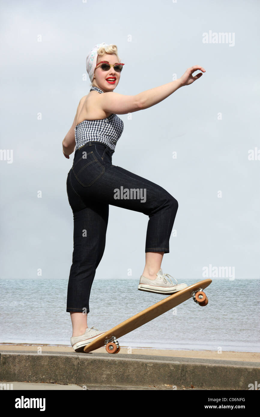 Woman on a vintage skateboard Stock Photo
