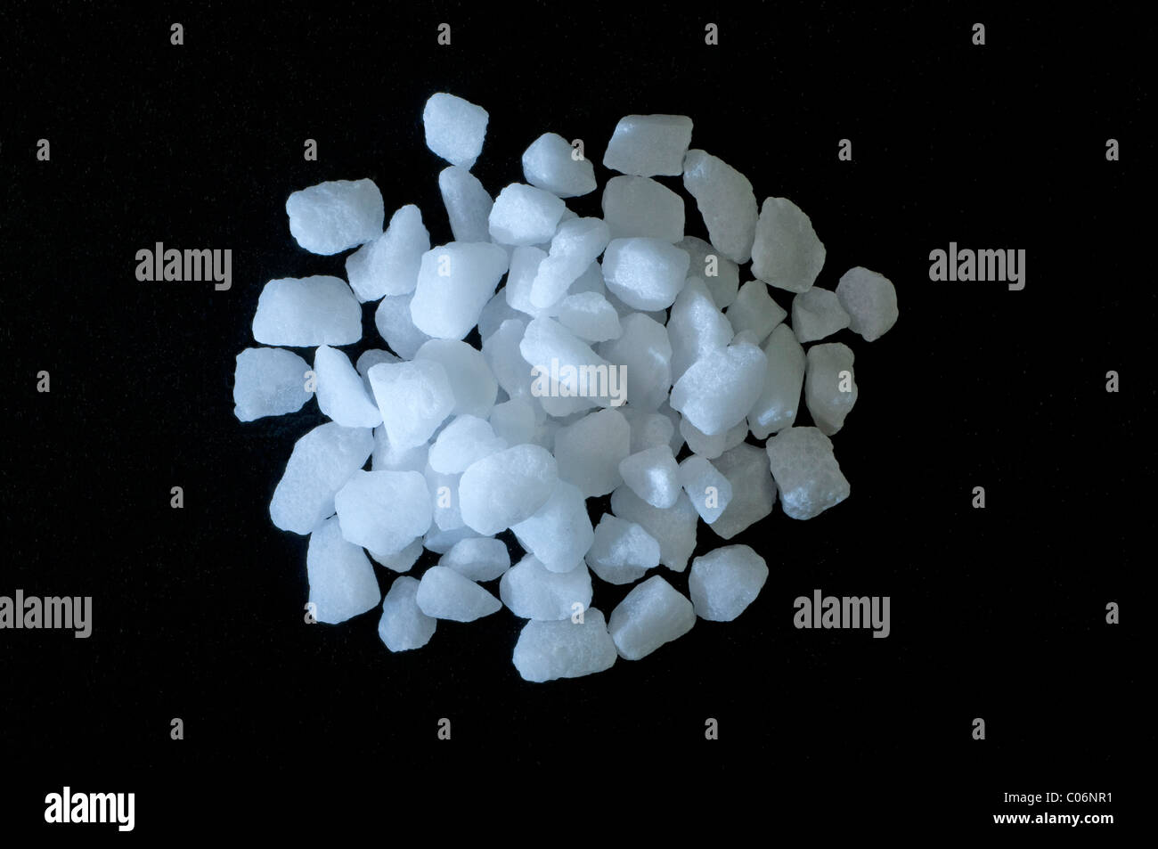 Table Salt (sodium chloride), studio picture against a black background. Stock Photo