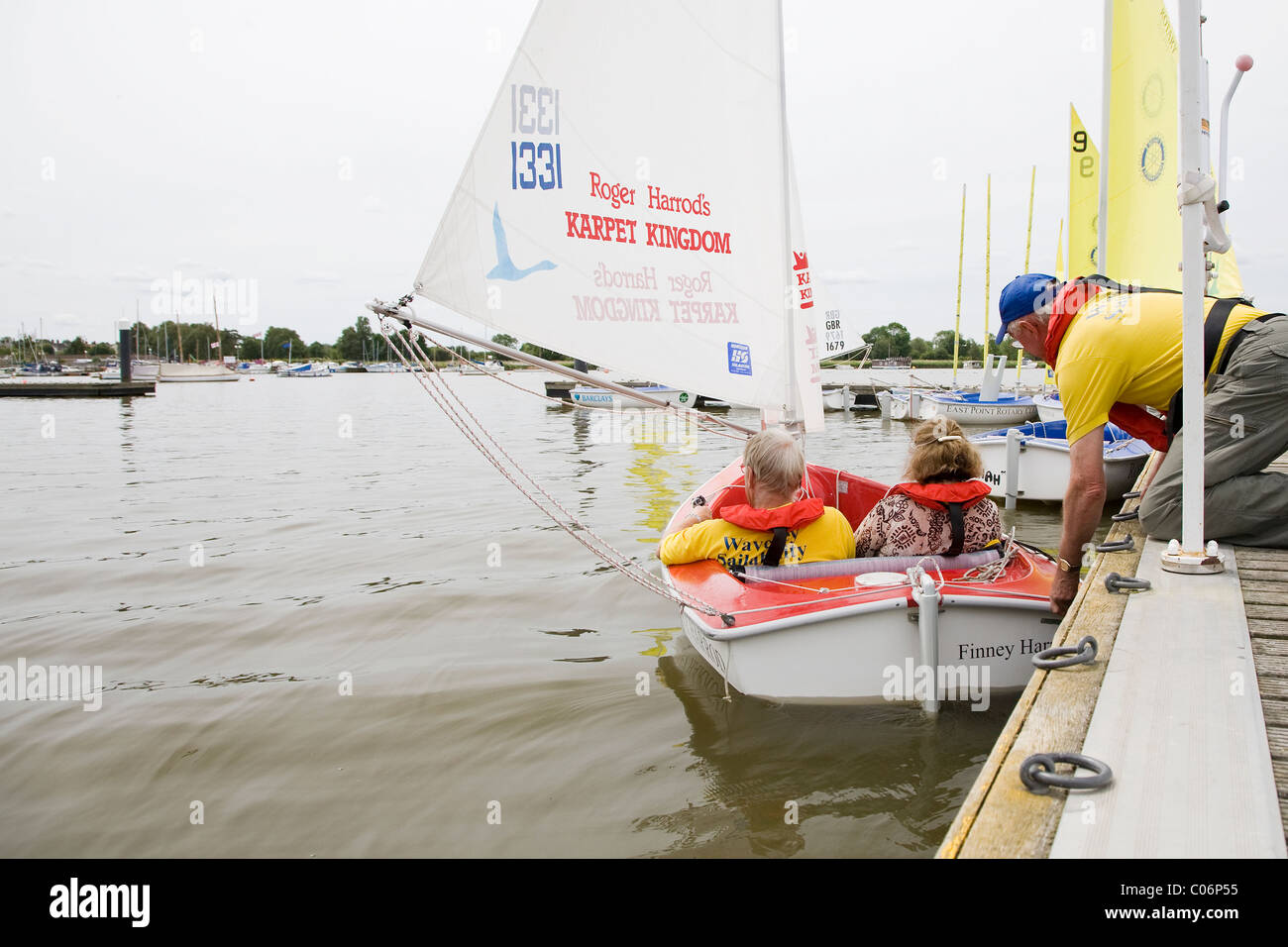 Sail dinghy modified for disabled people launches at Oulton Broad - courtesy of the Waveney Sailability Trust Stock Photo