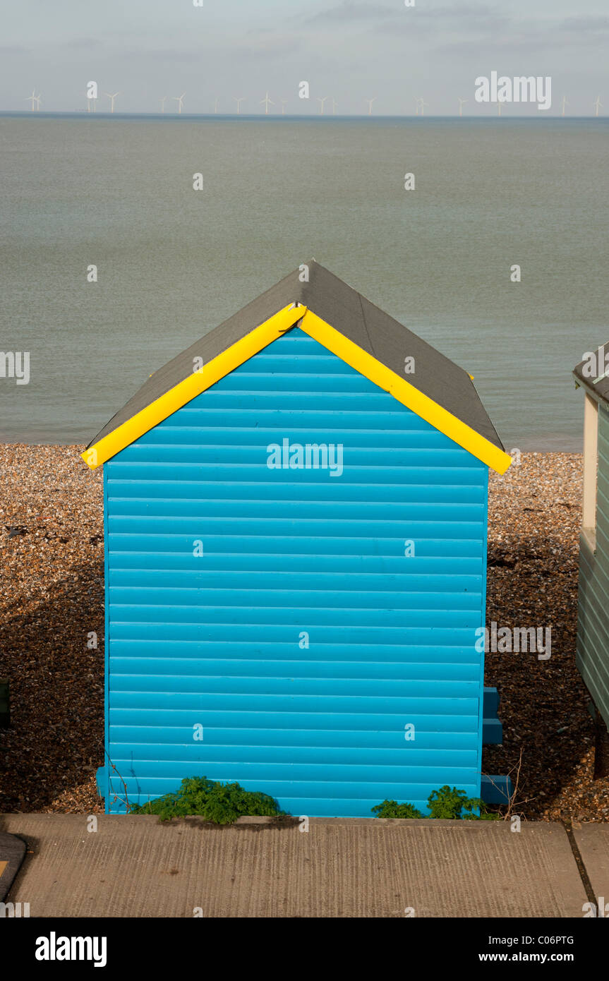 Beach huts on stoney beach Herne Bay seaside town in north kent england