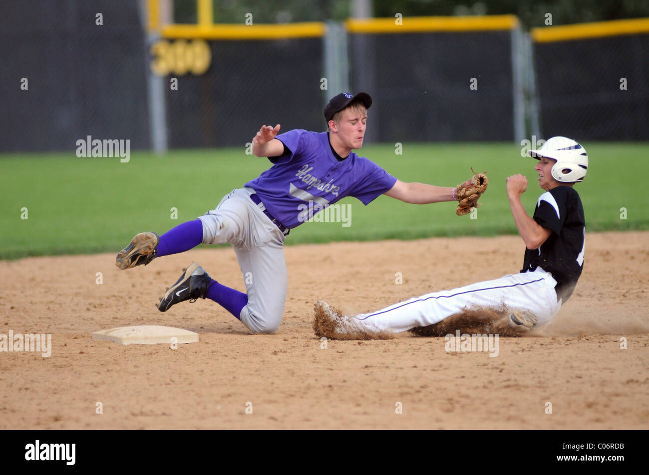 Infielder dives in an effort to catch the catcher's throw and tag the