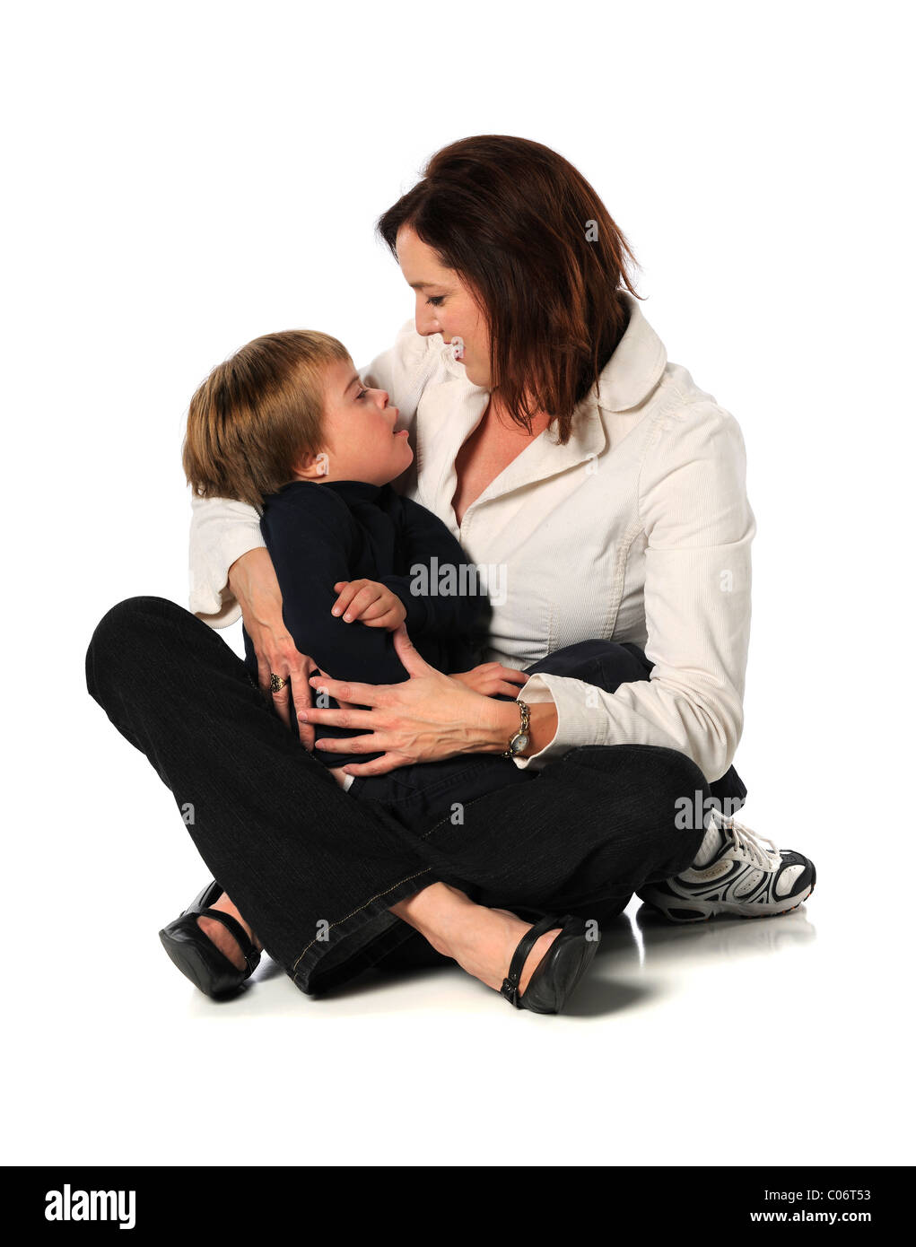 Mother and son with Down Syndrome isolated over white background Stock Photo