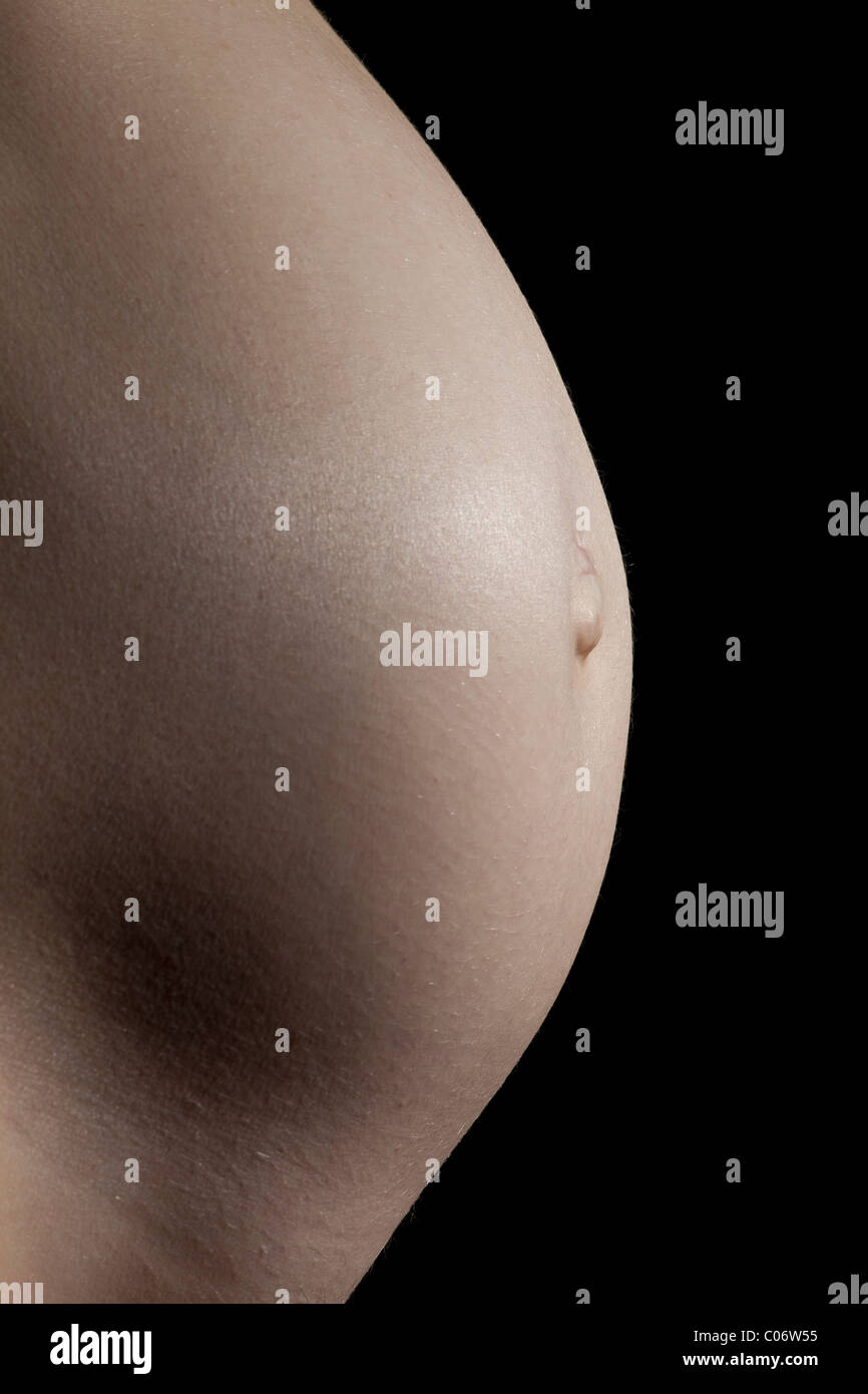 Naked pregnant caucasian 6 - 7 months (26 weeks). Stock Photo