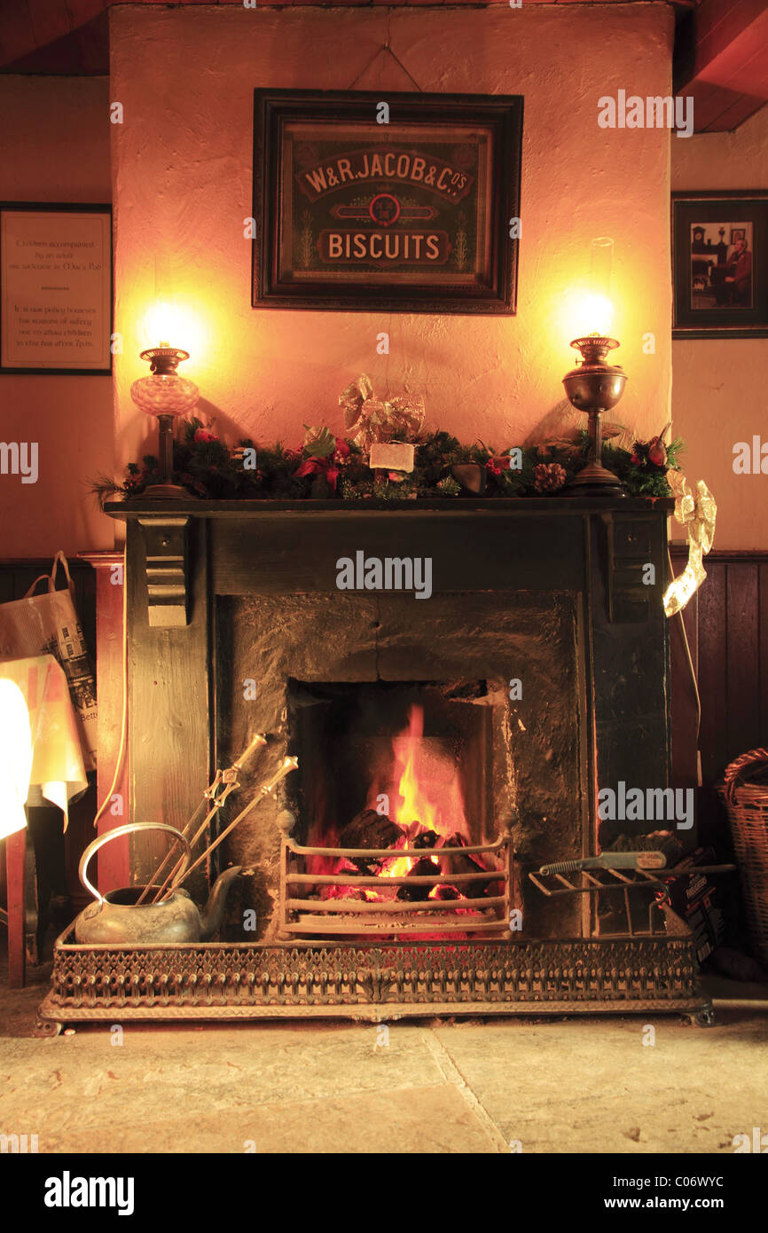 A peat fire in a traditional Irish pub, Co. Clare, Rep of Ireland. Stock Photo