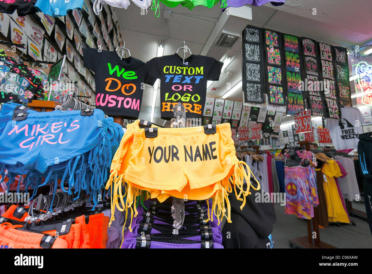 Beach clothing in a store on the boardwalk at the ocean Stock Photo - Alamy