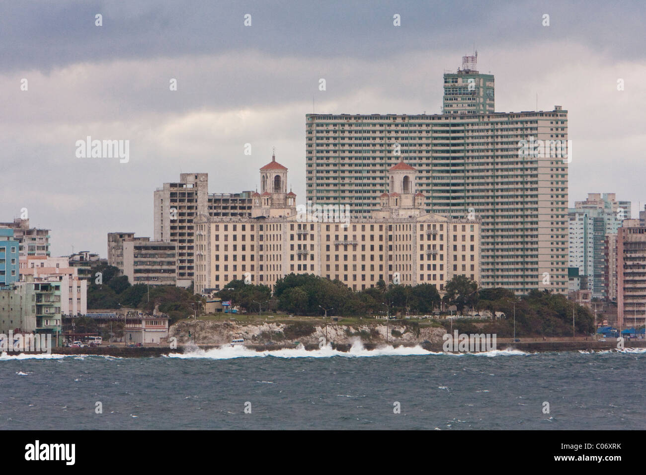 Cuba, Havana. Hotel Nacional (with trees in front) Viewed from El Morro Fortress.  Edificio Focsa, taller building behind the hotel. Stock Photo