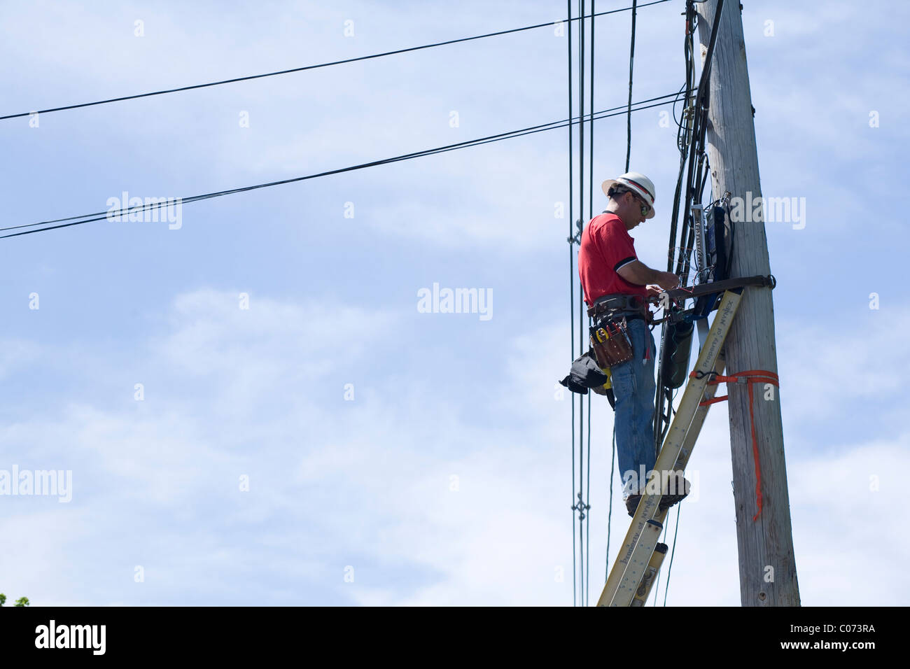 Telephone linesman works on telephone line Stock Photo Alamy