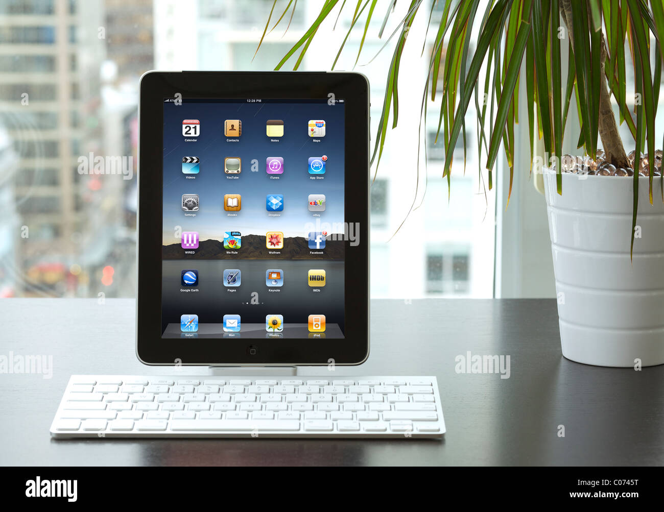 iPad being used in an office with wireless bluetooth keyboard showing the application screen Stock Photo