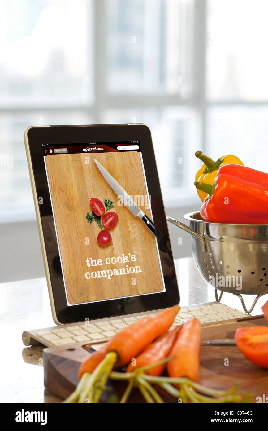 iPad Epicurious cooking application screen being used in the kitchen Stock Photo