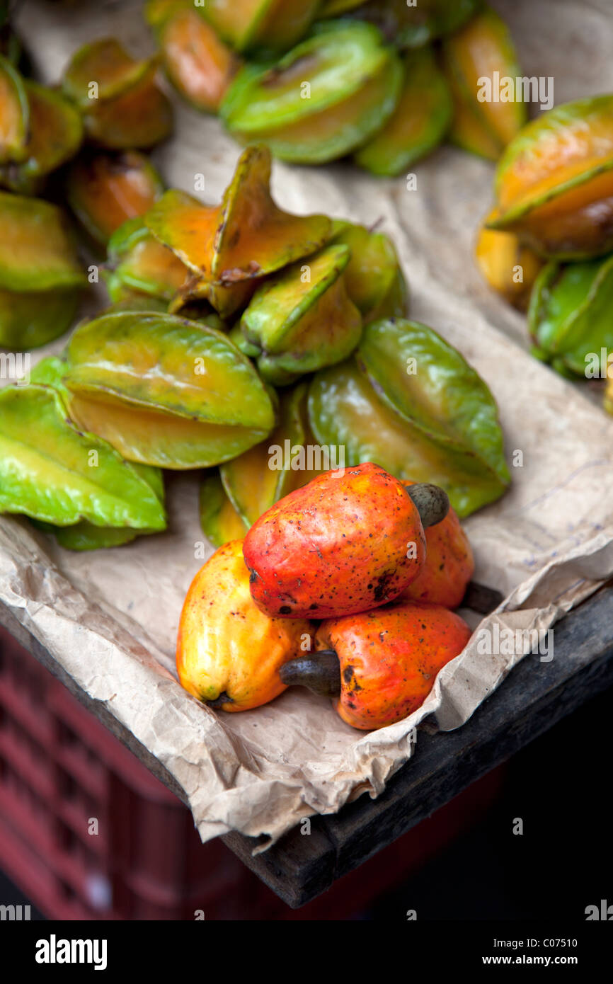 Cashew Fruit and Carambola (Starfruit) for sale in the Amazonian market of Belen in the Peruvian city of Iquitos. Stock Photo