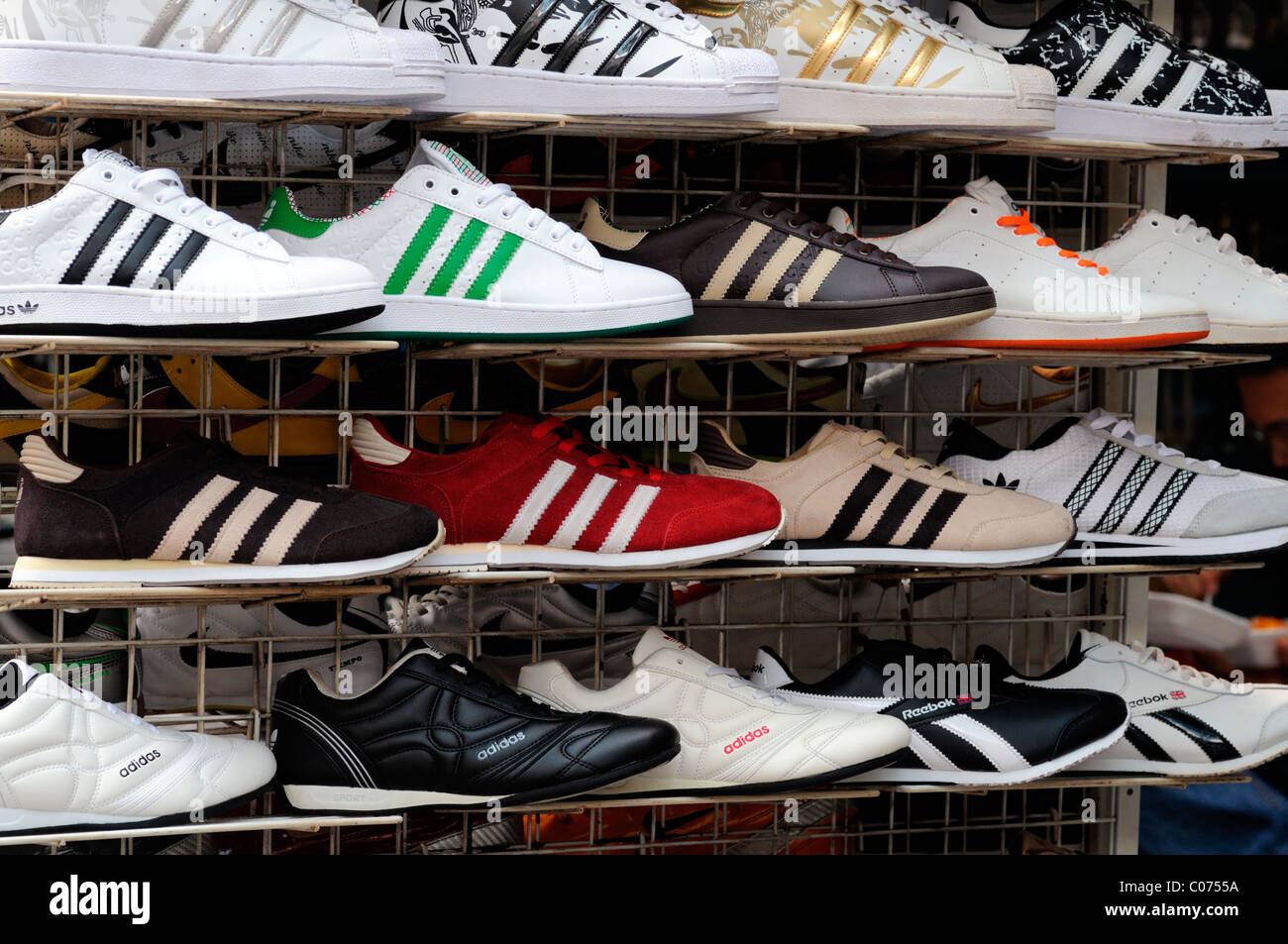 fake designer pirate pirated shoes runners footwear on sale stall petaling  street chinatown kuala lumpur malaysia illegal Stock Photo - Alamy