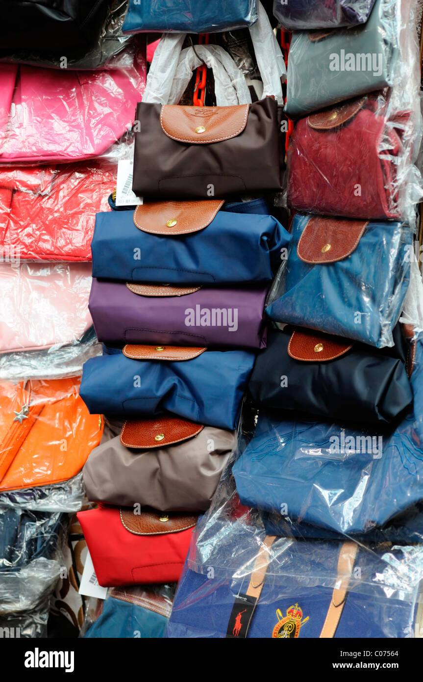 fake designer bags handbags blue leather pirate pirated luxury goods sale  stall petaling street chinatown kuala lumpur malaysia Stock Photo - Alamy