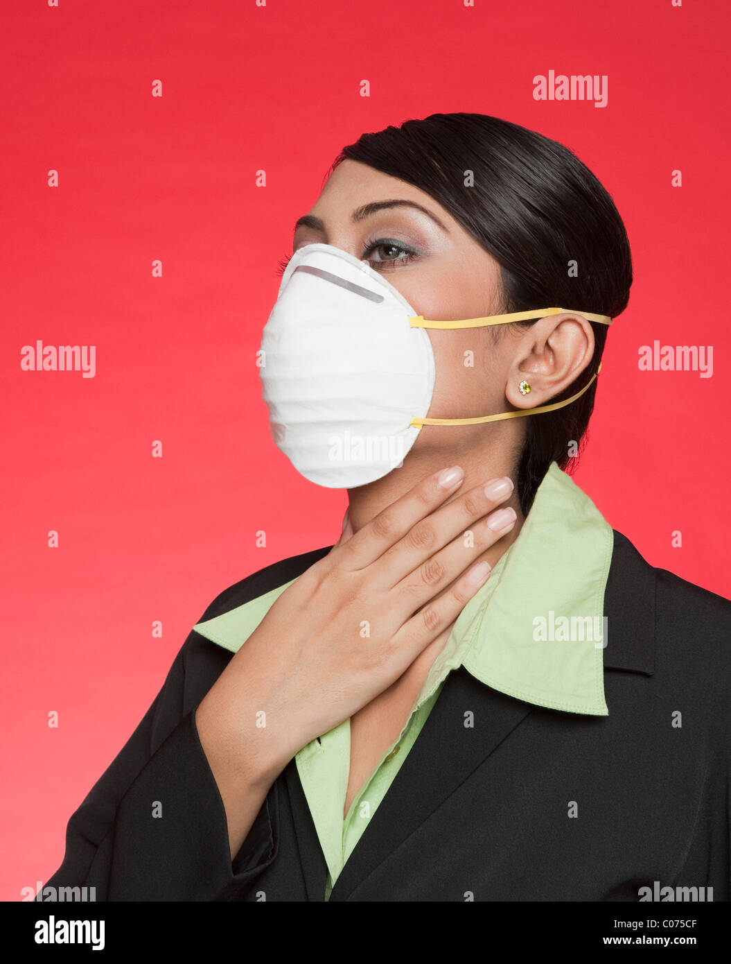 Businesswoman wearing a pollution mask Stock Photo