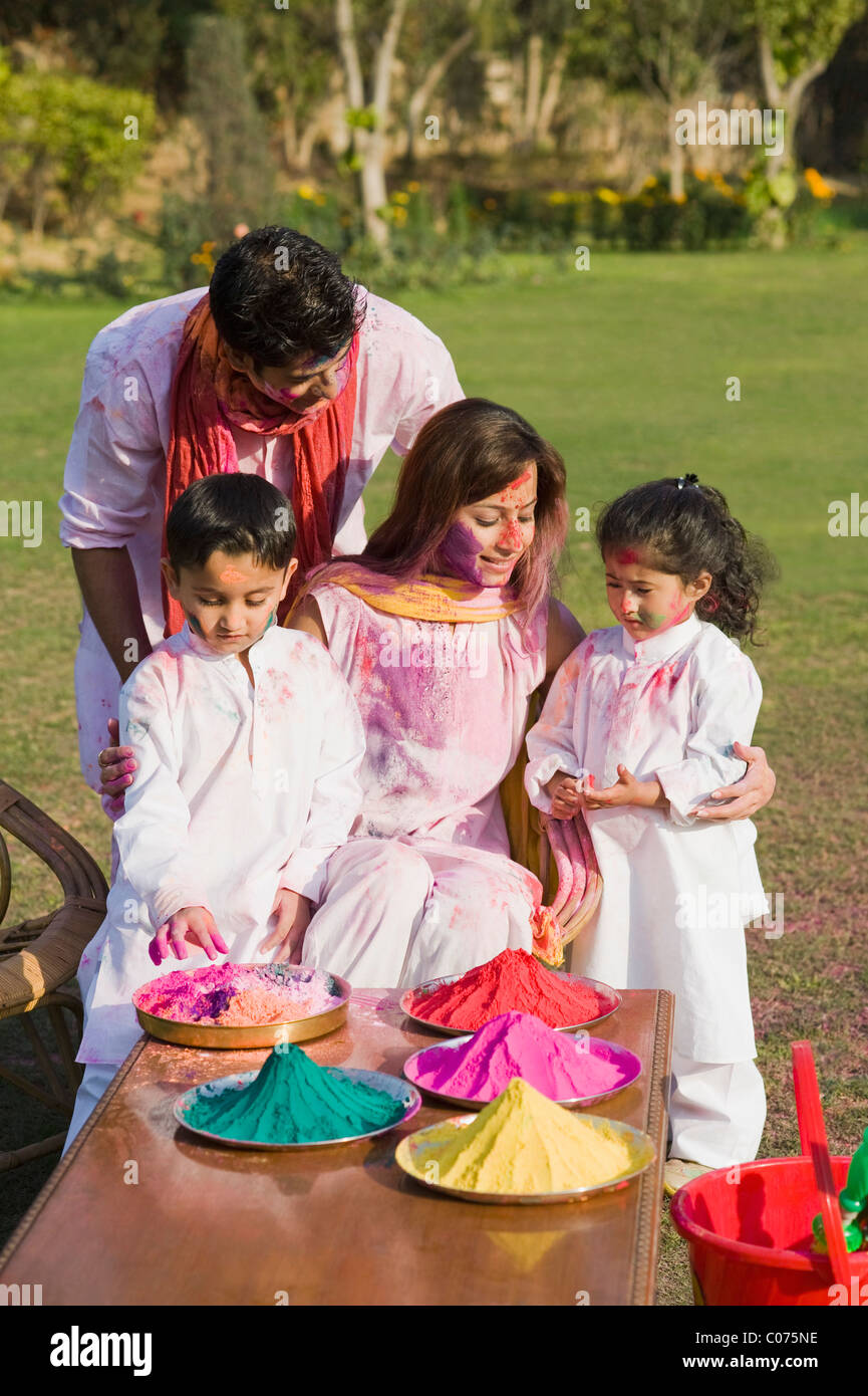 Family celebrating Holi in a garden Stock Photo Alamy