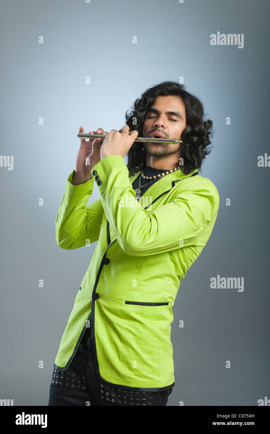 Man playing a flute Stock Photo