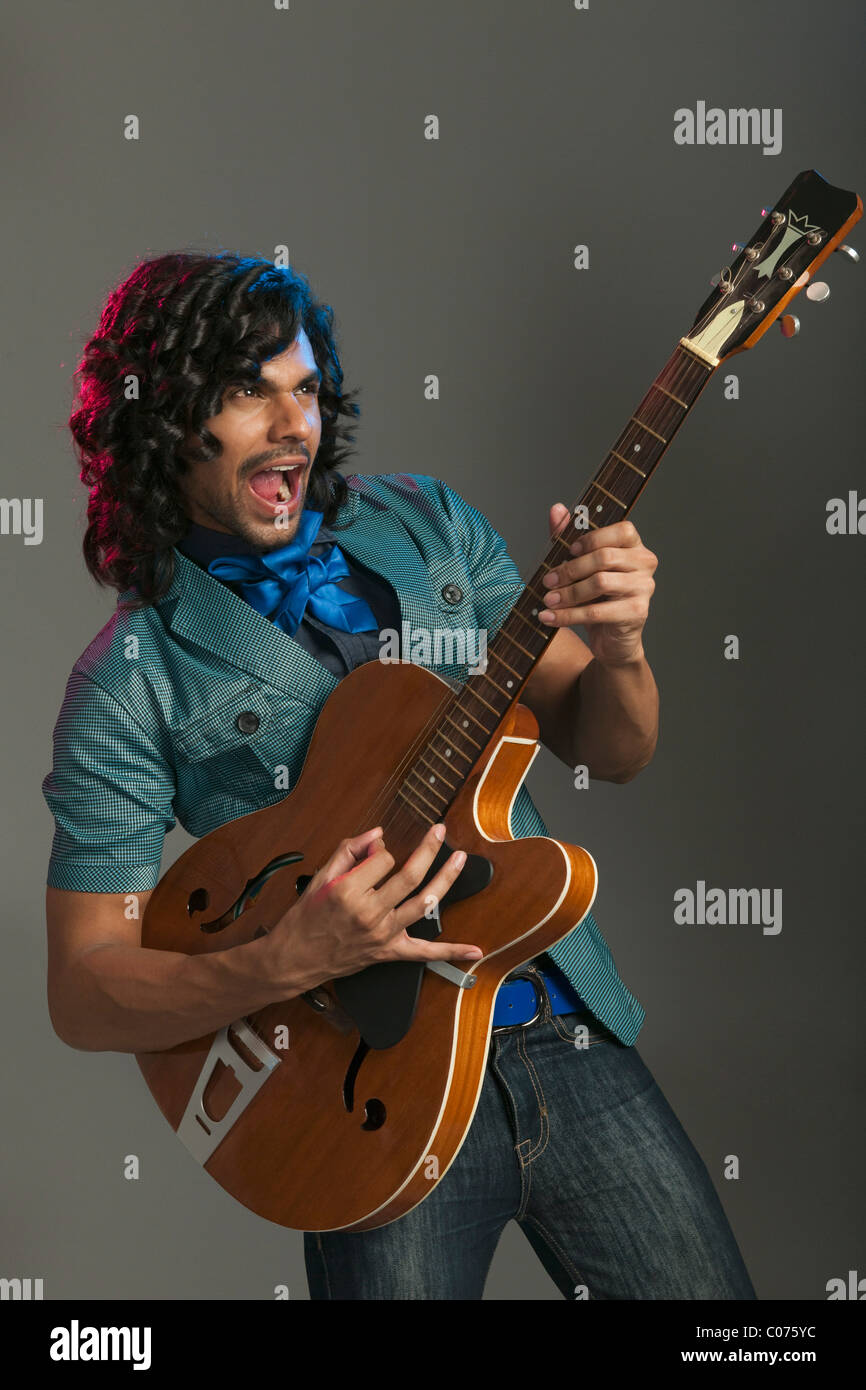Person guitarist hairstyle human hi-res stock photography and images - Alamy