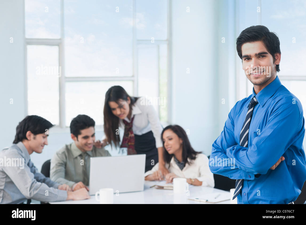 Portrait of a businessman with his arms crossed Stock Photo - Alamy