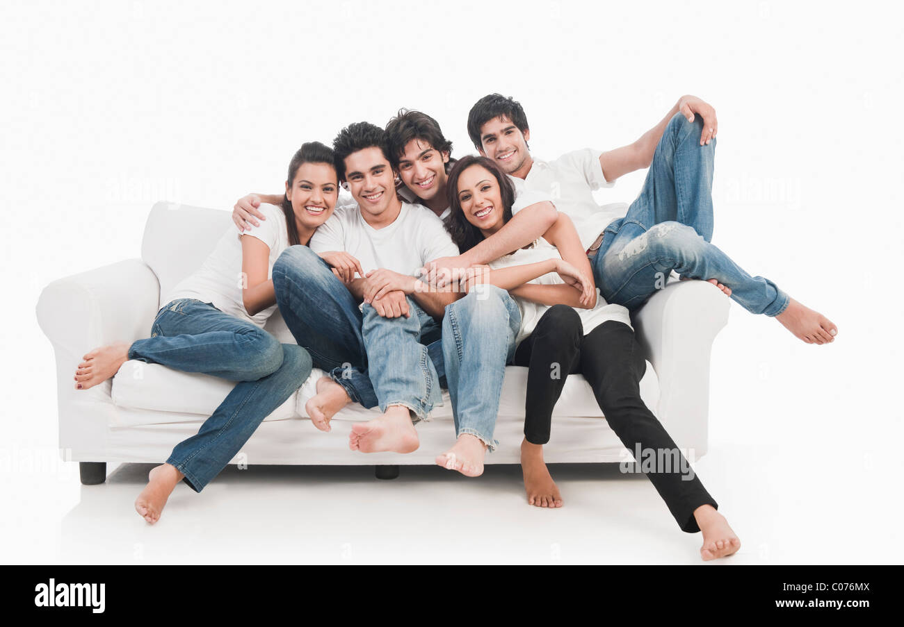 Friends on a couch Stock Photo Alamy